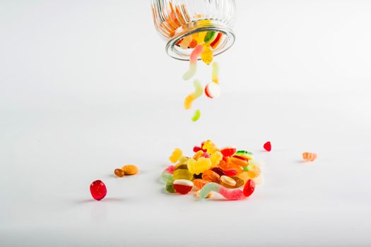 sweets spilling from jar. High resolution photo