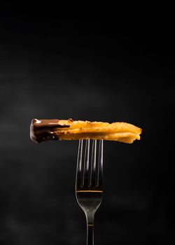 minimalist fried churros fork front view. High resolution photo