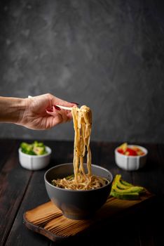 noodles bowl with avocado copy space. High resolution photo