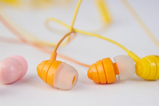 close up of colorful earphone on white background ,