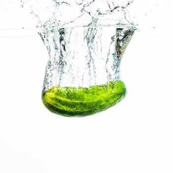 cucumber falling water water splash against white background. High resolution photo
