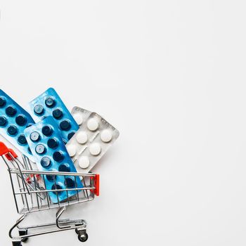 top view pills inside shopping cart. High resolution photo