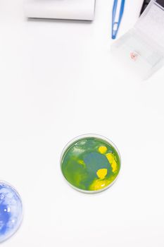 Mixed of bacteria colony in petri dish standing on table in biological scientific hospital laboratory. Pharmaceutical microorganism liquid sample. Liquid medical microorganism