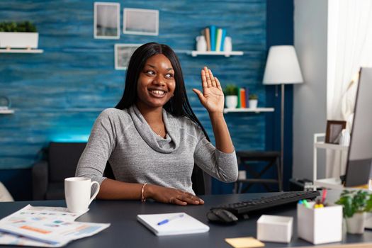 African american woman greeting university collegue discussing maths course during online videocall meeting conference. Black student working remote from home using elearning platform