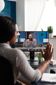 African american woman greeting remote entrepreneur using laptop computer webcam during online videocall meeting teleconference. Overworked black student discussing academic course ideas