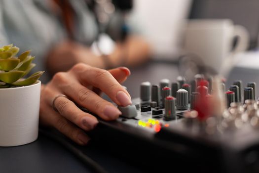 Close up of online live podcast studio desk with mixer in home studio of new creator. Influencer recording social media content with professional equipment for subscribers