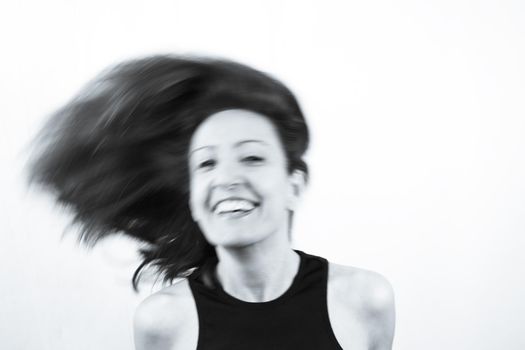 Motion blur portrait of woman over 40. Black tshirt