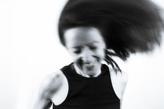 Motion blur portrait of woman over 40. Black tshirt