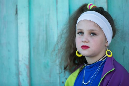 Little girl with bright makeup in retro style. Child model.