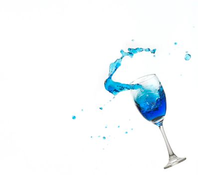 Wine glass on white background whit a blue water splash.