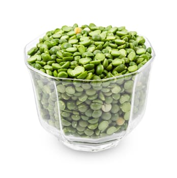 Organic green split peas filling a small bowl isolated on a white background. Save clipping path.