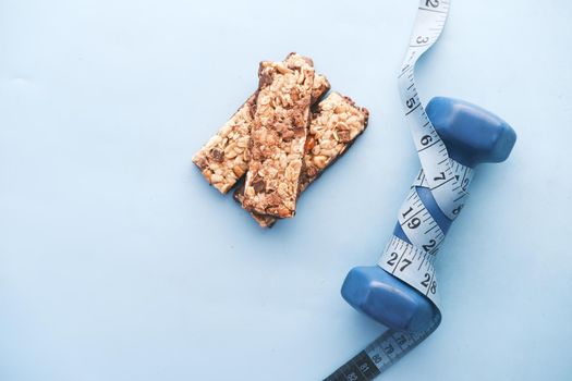 Almond , Raisin and oat protein bars on table .