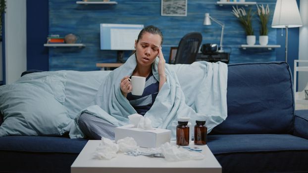 POV of sick patient asking for treatment on video call to cure seasonal flu and throat pain. Woman with illness using online conference for telemedicine talking to doctor about pills