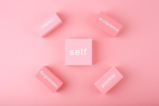 Self love, respect, acceptance, forgiveness and prioritize concept in bright pastel pink colors. Mental health, self love and wellness concept or psychological health 