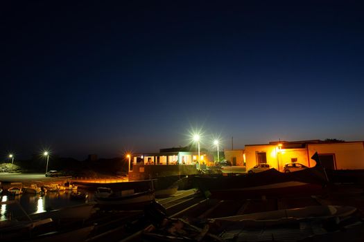 Night view of the Linosa old pier, Pelagie islands. Sicily