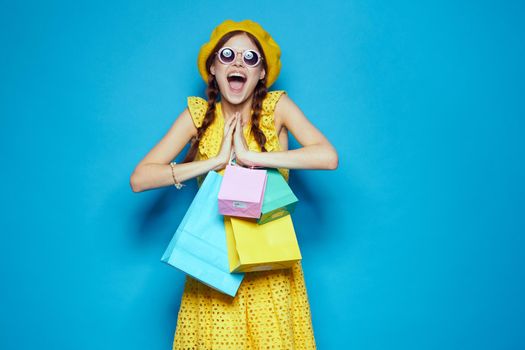 pretty woman with multicolored bags posing studio model. High quality photo