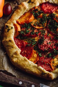 Freshly baked tomato galette on baking paper