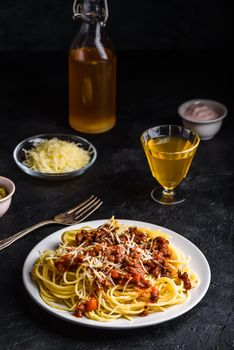 Spaghetti with bolognese sauce and grated parmesan cheese