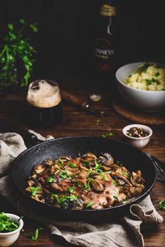 Fried pork neck steak with different mushrooms and mashed potatoes