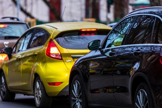 Cars in traffic at rush hour in downtown area of the city. Car pollution, traffic jam in the morning and evening in the capital city of Bucharest, Romania, 2021