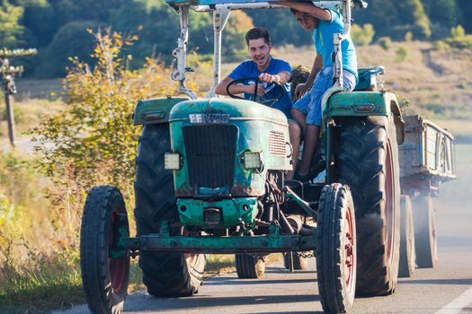 Agricultural tractor on road in Viscri, Romania, 2021