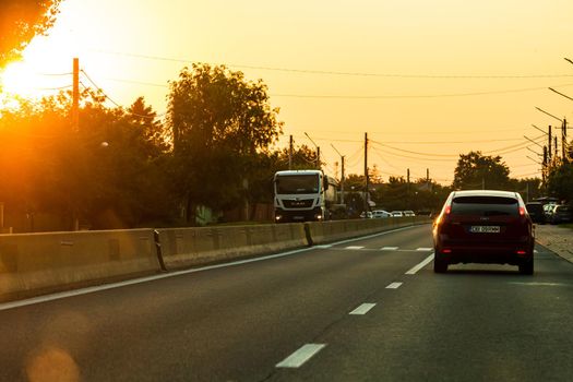 Car traffic at rush hour. Traffic jam, cars on the road at sunset in Bucharest, Romania, 2021