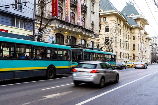 Cars in traffic at rush hour in downtown area of the city. Car pollution, traffic jam in the morning and evening in the capital city of Bucharest, Romania, 2021