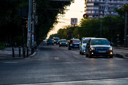 Cars in traffic at rush hour in downtown area of the city. Car pollution, traffic jam in the morning and evening in the capital city of Bucharest, Romania, 2021