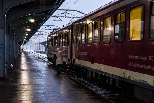 Winter detail train view. Train on the platform of Bucharest North Railway Station (Gara de Nord Bucuresti) in Bucharest, Romania, 2021