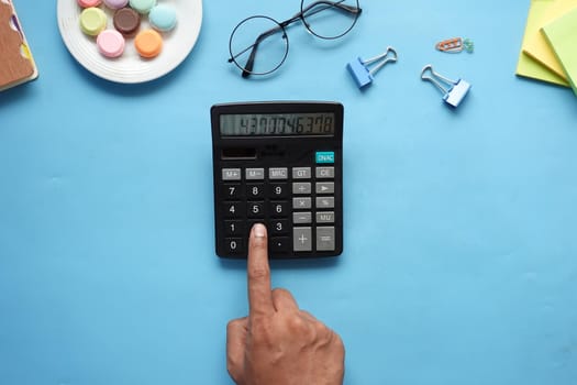 flat composition of smart phone, mask, thermometer and sanitizer on table .