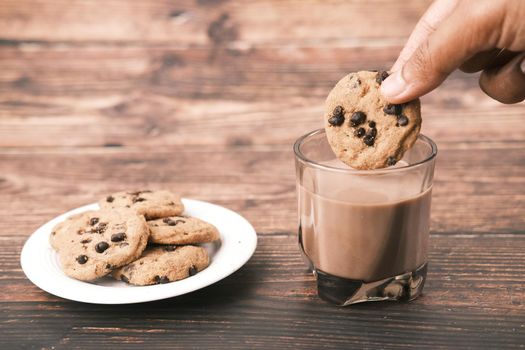 chocolate cooking and a glass of chocolate milkshake on table ,