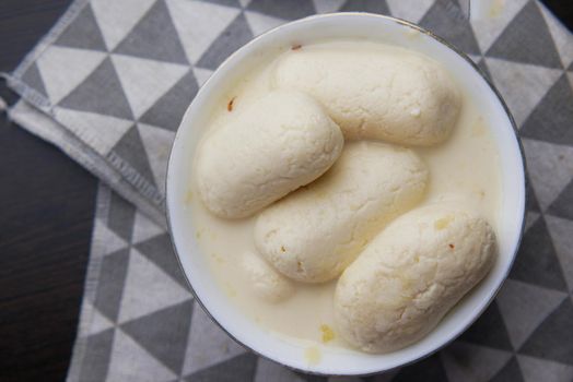 close up of indian sweet in a bowl on table