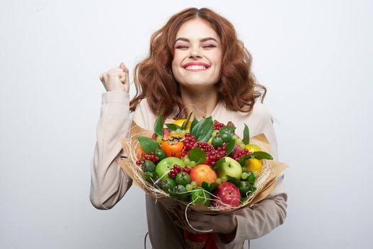 beautiful woman fashionable hairstyle bouquet of flowers decoration light background. High quality photo