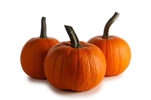 Three orange pumpkin isolated on white background