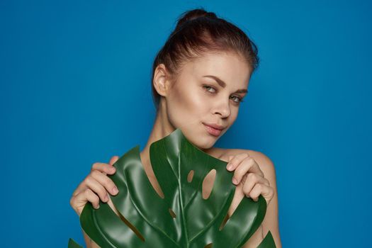 pretty woman clean skin palm leaf cosmetics spa treatments. High quality photo