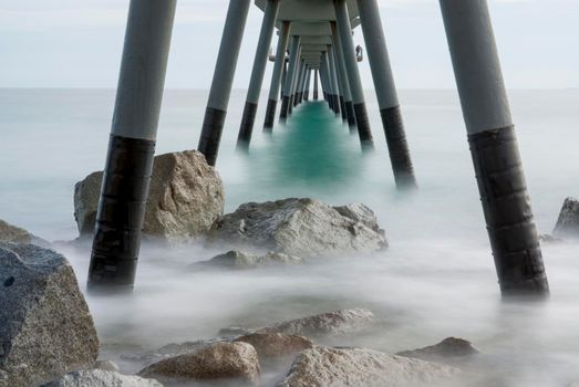 mediterranean sea with view to the pontoon and beach - Pont del Petroli, Badalona, Barcelona, Catalonia, Spain.