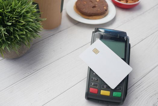 contactless payment concept credit card on a pos machine .