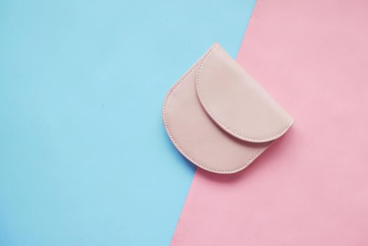 a small women purse wallet on color background .