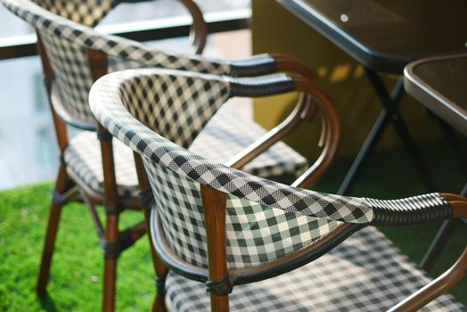 many empty chair at cafe during corona virus period .