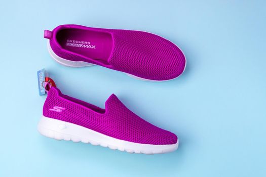 Tyumen, Russia-August 27, 2021: Slip-on shoes for women Skechers Go Walk Joy purple. Skechers USA, Inc. is an American lifestyle