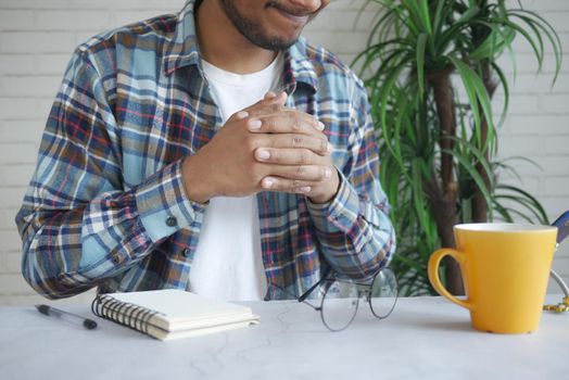 a nervous young man hand .