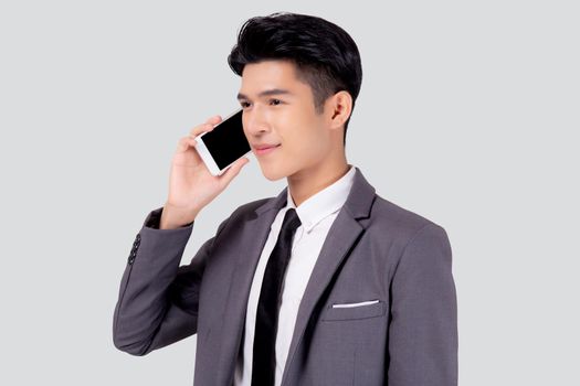 Young asian business man in suit talking on mobile phone isolated on white background, businessman speaking and listening smartphone with conversation, male holding cell phone, communication concept.