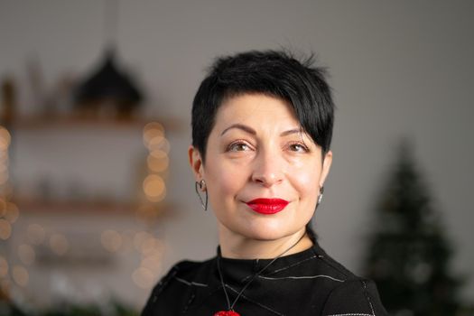 Portrait of smiling short haircut brunette woman. With tired eyes.