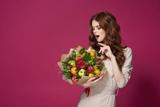 cheerful woman smile posing fresh fruits bouquet emotions isolated background. High quality photo