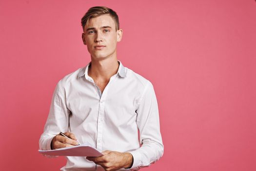 businessmen reading documents in hand pink background. High quality photo