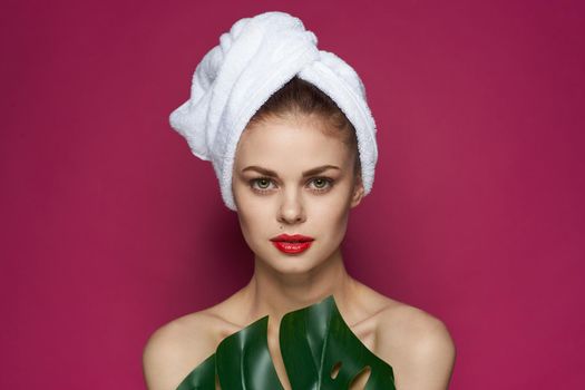 pretty woman bare shoulders red lips posing pink background. High quality photo