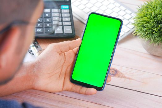 young man using smart phone indoor .