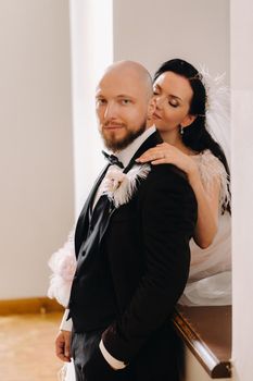 Elegant wedding couple in the interior of the old castle in the city of Nesvizh.