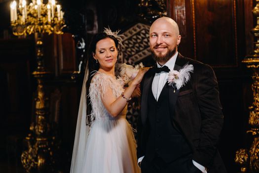 Elegant wedding couple in the interior of the old castle in the city of Nesvizh.