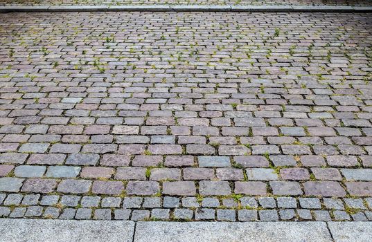 Close up view on old historical cobblestone roads and walkways all over europe